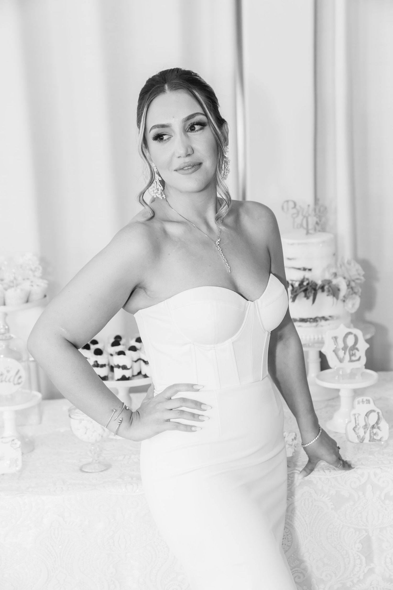 Classic black and white bridal portrait with elegant styling and soft lighting.