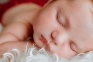Close-up of a sleeping baby with soft, peaceful features.