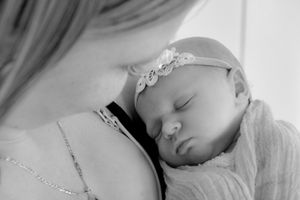 Black and white close-up of gentle newborn photography.