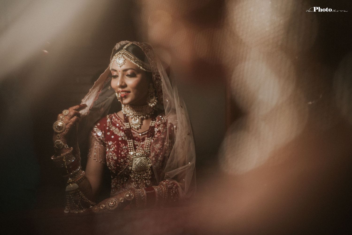 Traditional Indian bridal details captured in moody artistic photography.