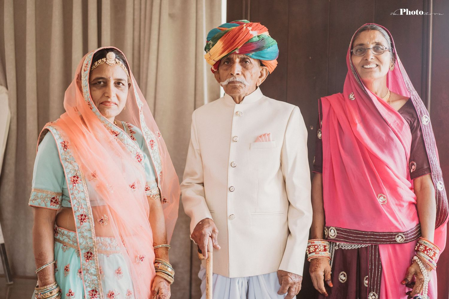 Wedding guests in traditional Rajasthani attire with colorful turbans and ethnic wear.