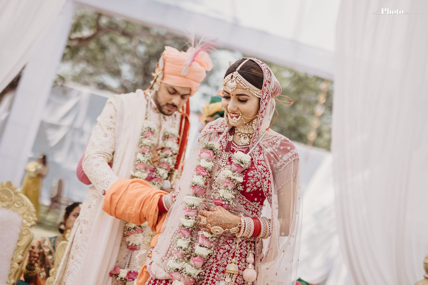 Close-up shots of wedding ceremony moments under elegant white canopy decor.