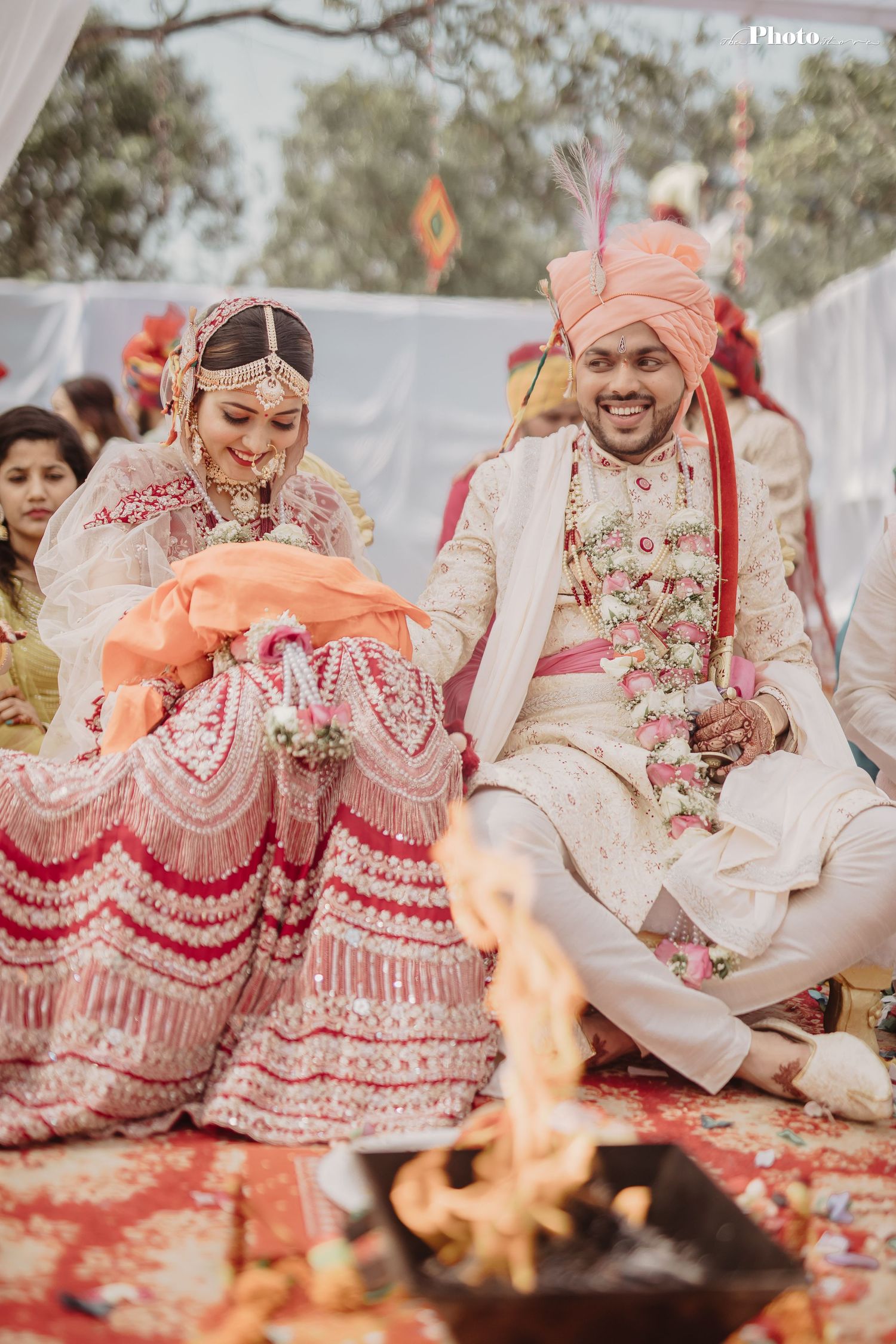 Traditional Hindu wedding ceremony with sacred fire and decorative red lehenga.