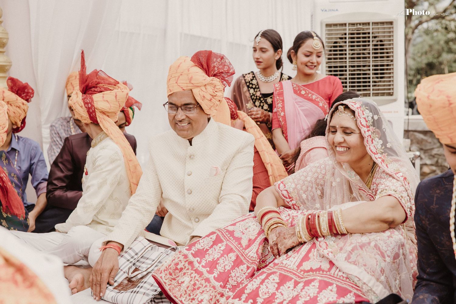 Wedding guests and family members gathered for traditional Indian marriage ceremony celebrations.