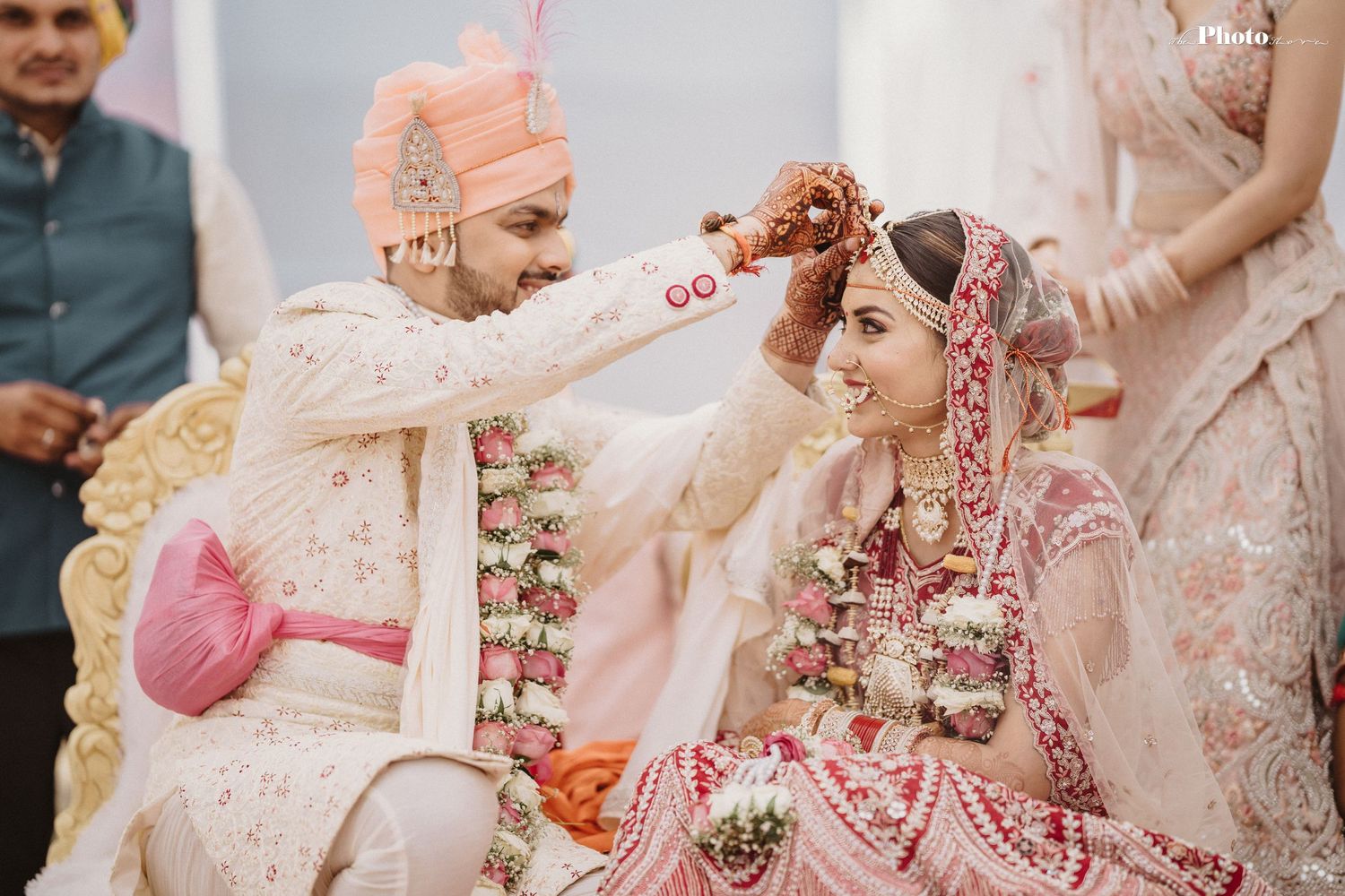 Traditional Indian wedding ceremony with participants seated during cultural rituals.