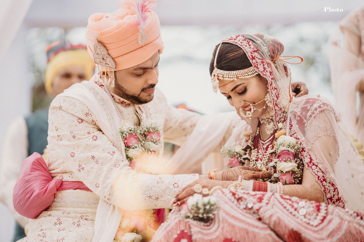 Candid moments from an Indian wedding ceremony showing traditional customs and rituals.