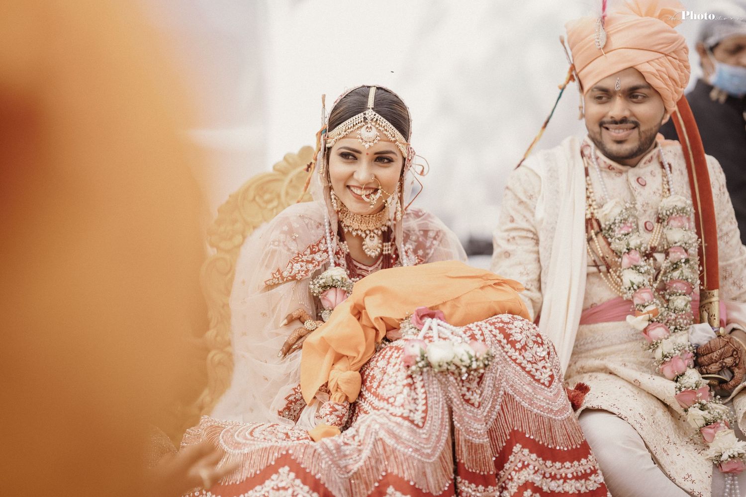 Joyful celebration scenes from an Indian wedding with traditional attire and decorations.