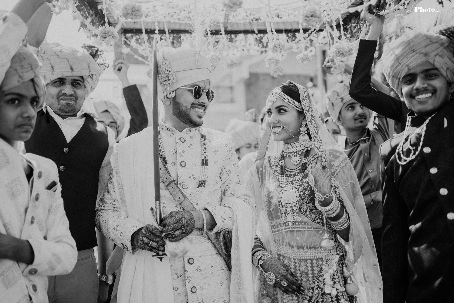 Black and white series of joyful moments from an Indian wedding celebration.