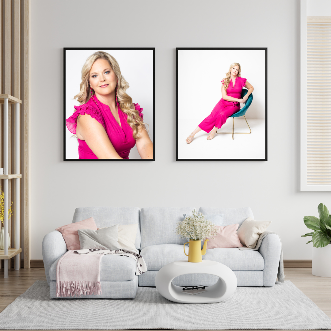 Living room with white sectional and two large prints of a woman in a pink jumpsuit with blonde hair. lady in teal chair