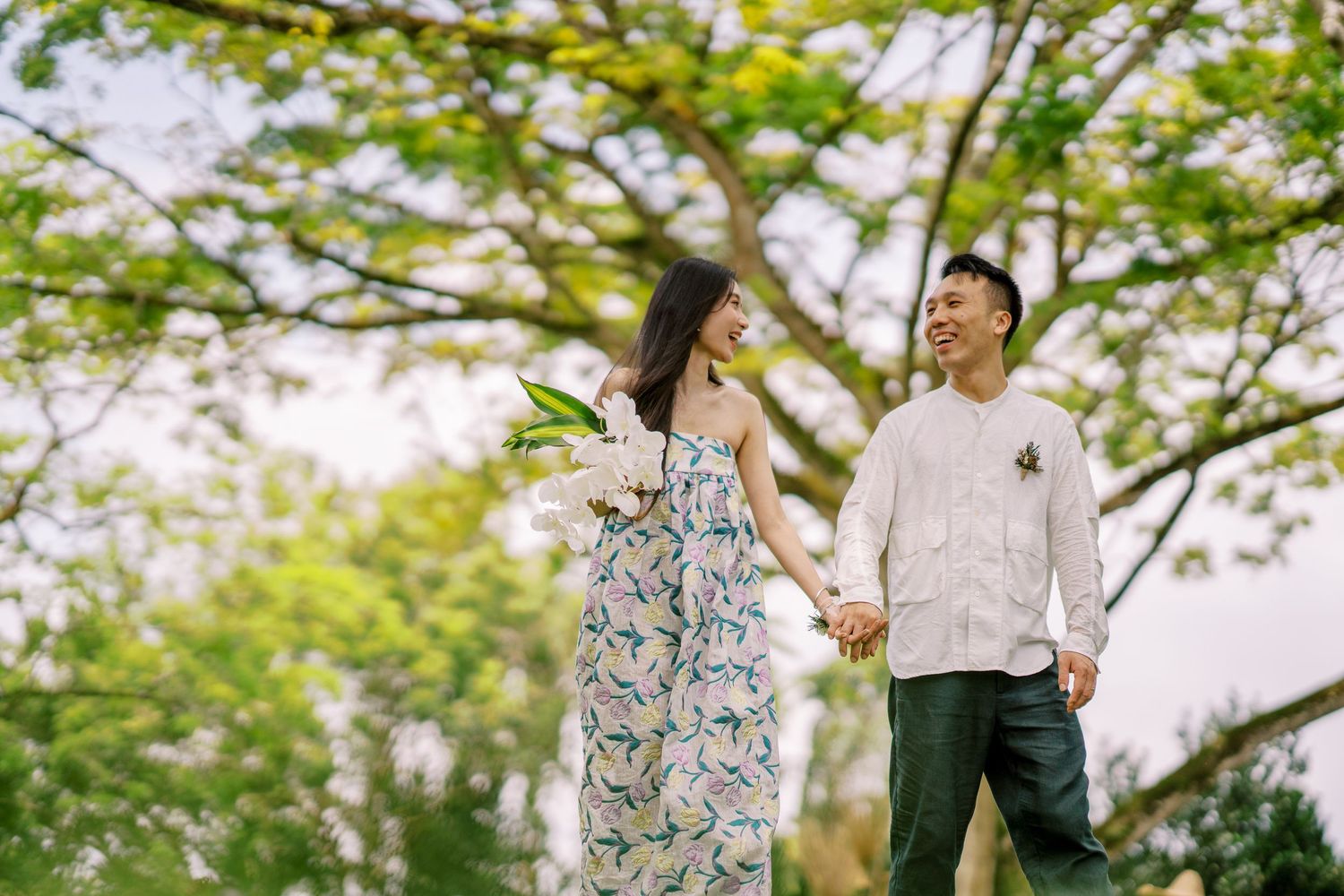 Joyful celebration moment in a sunlit garden pavilion.