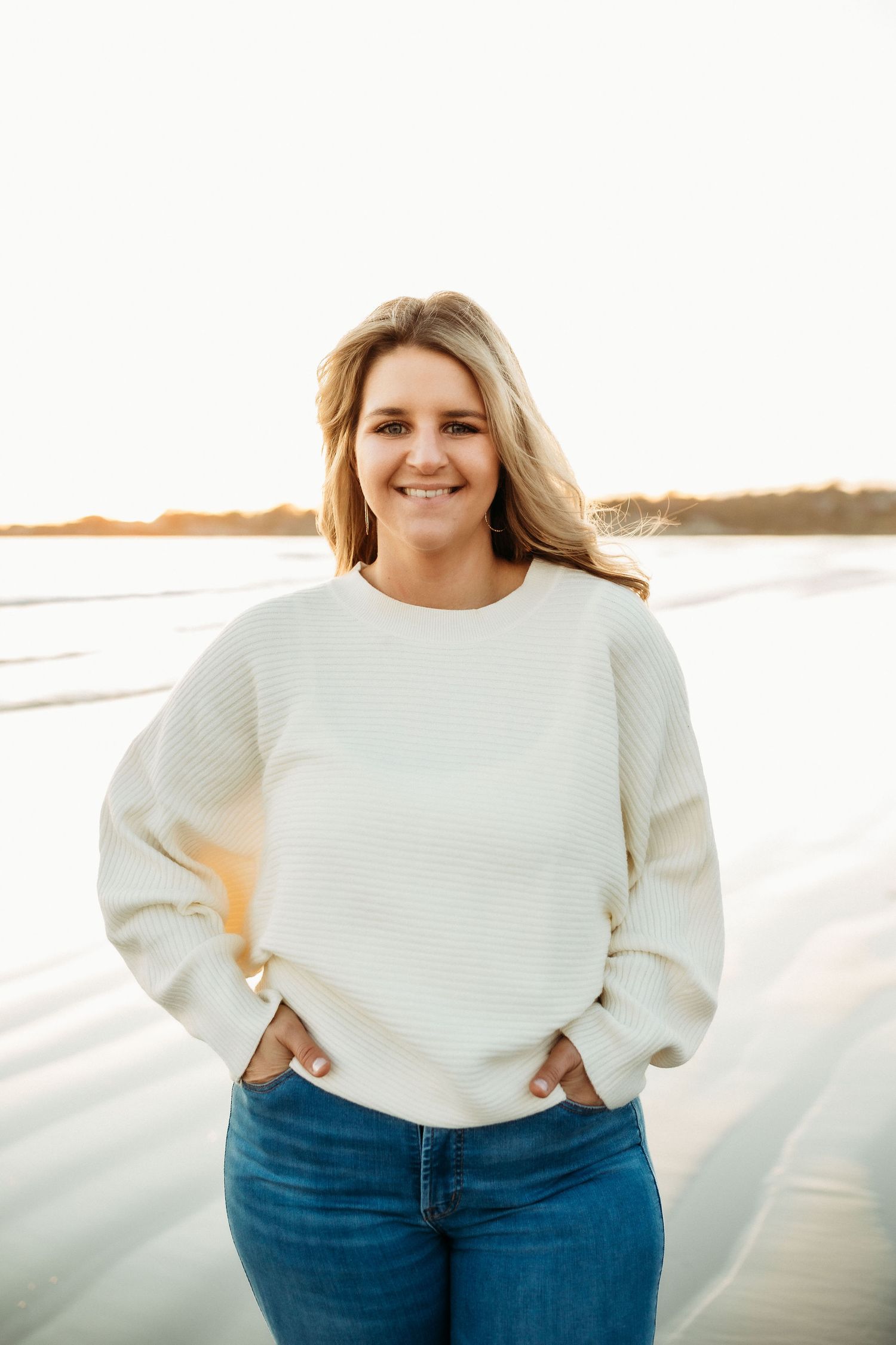 Winter beach portrait in cream sweater and jeans at golden hour. second beach Middletown Rhode Island