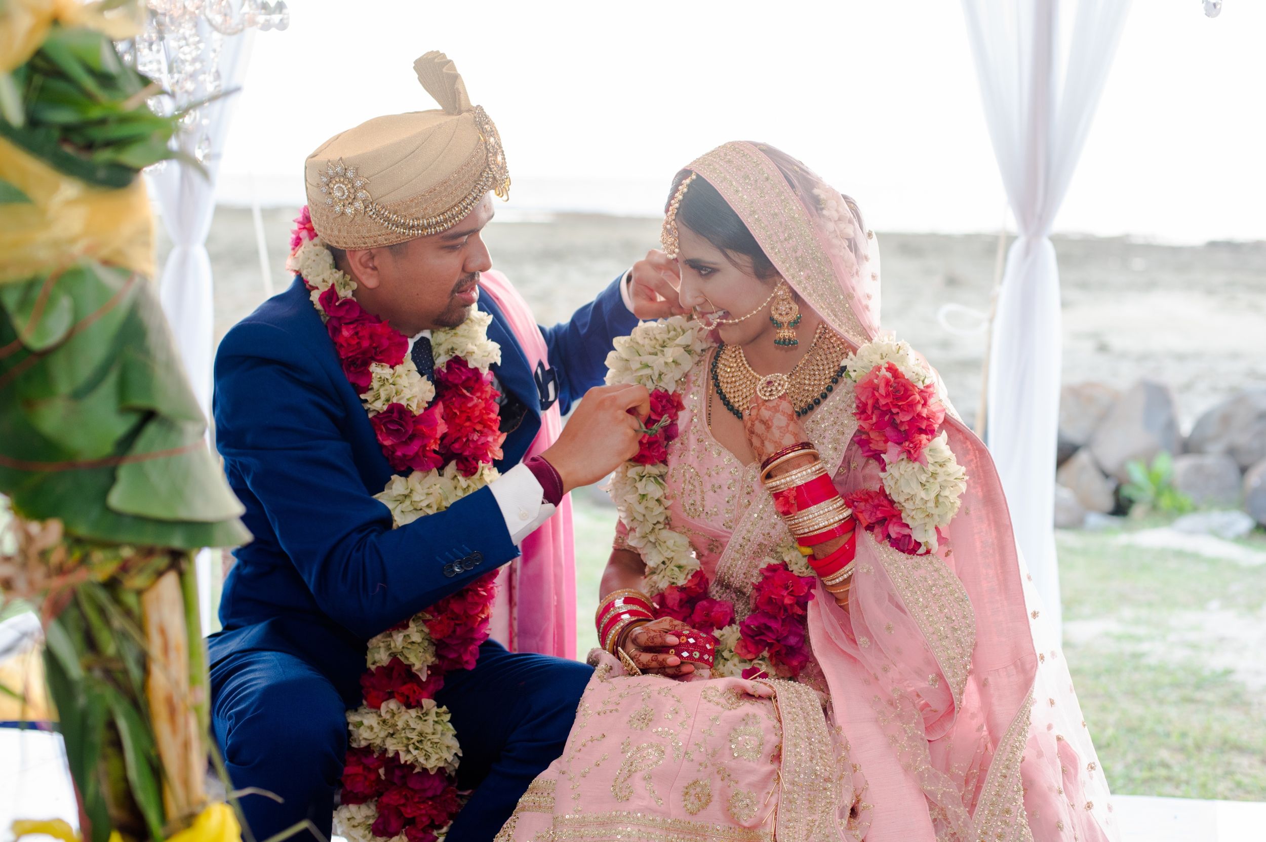 A couple sharing a joyful moment during their wedding celebration.