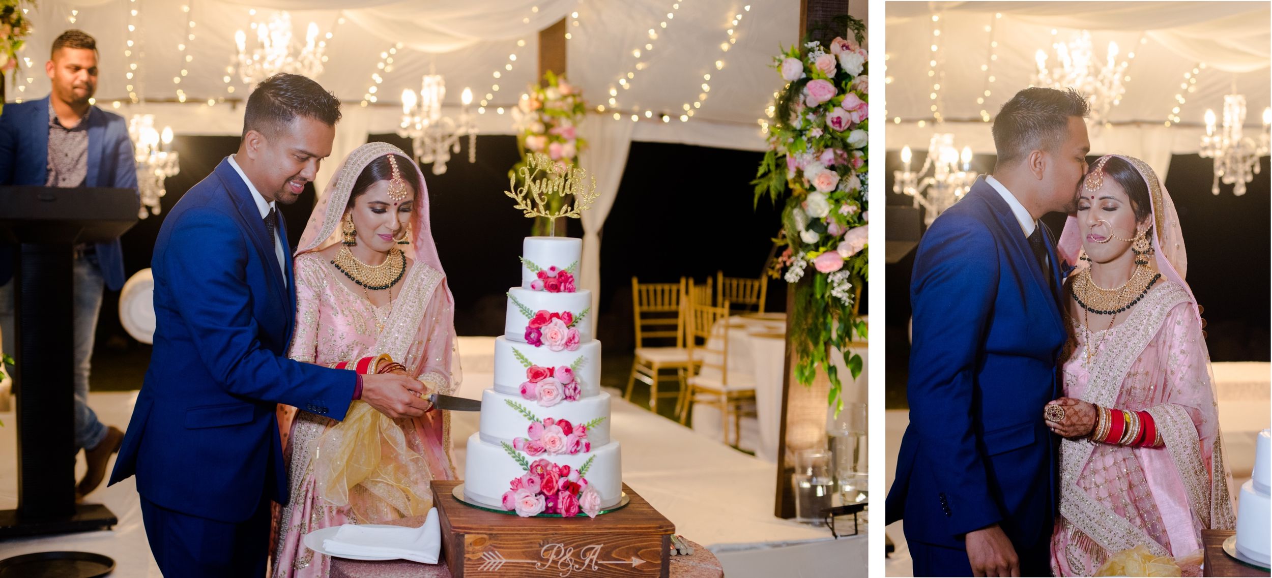 Couple cuts their pink and white tiered wedding cake during reception celebration.
