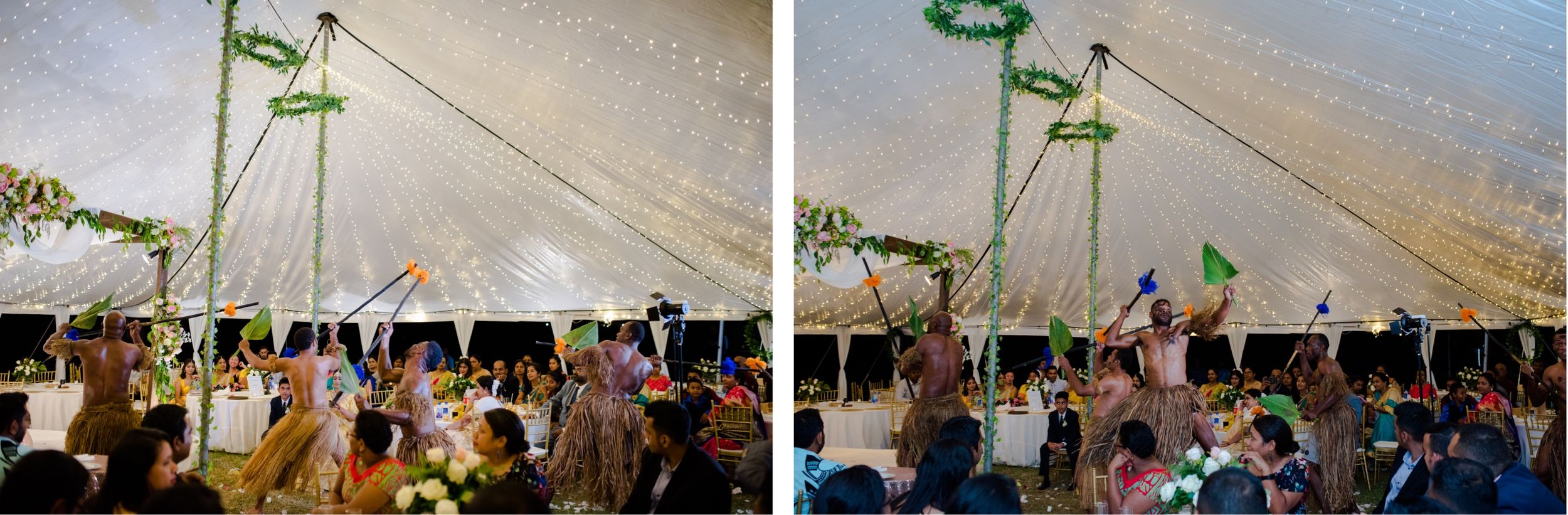 Wedding guests raise their hands in celebration under white tent reception.