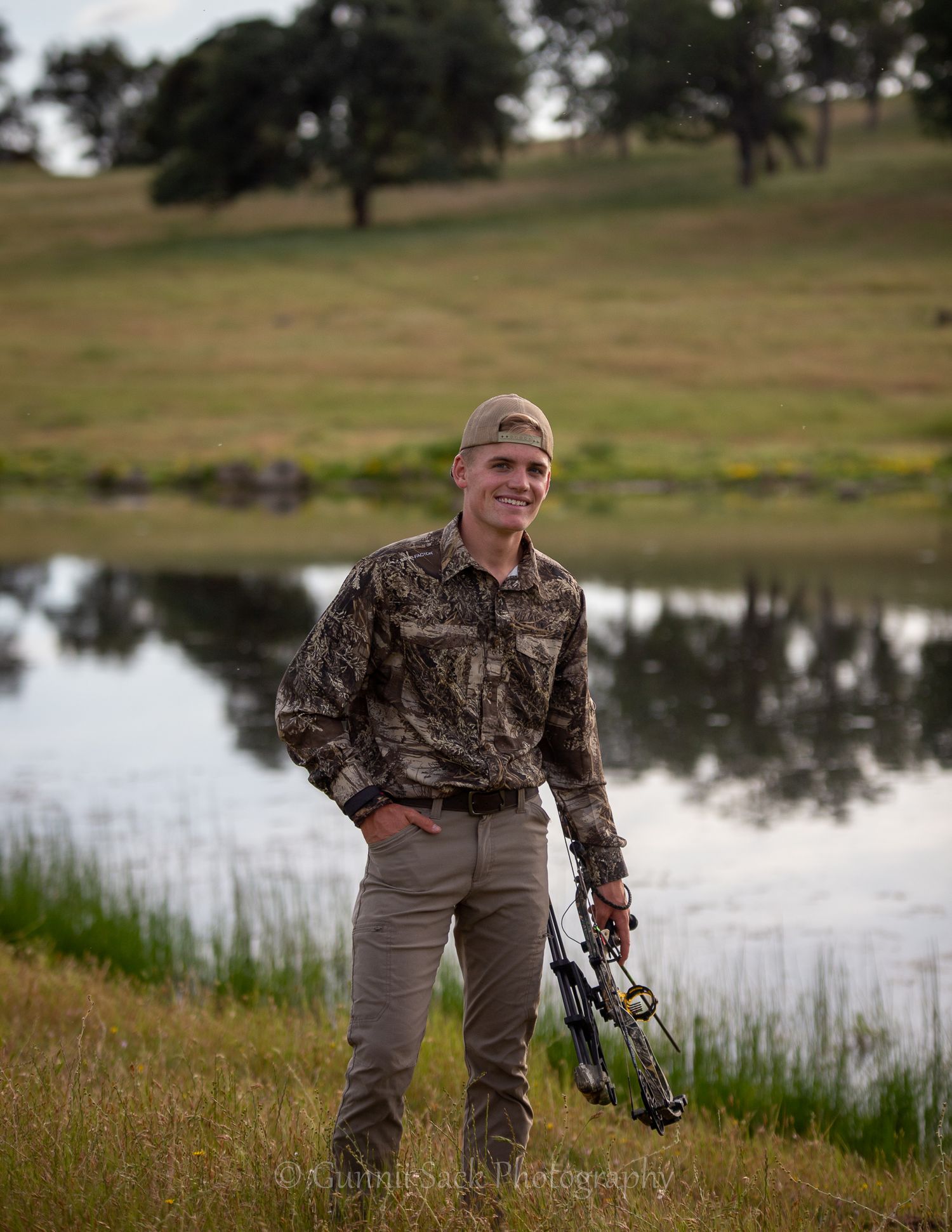 gunnii sack photography, bow hunter, pond, ranch, class of 2022