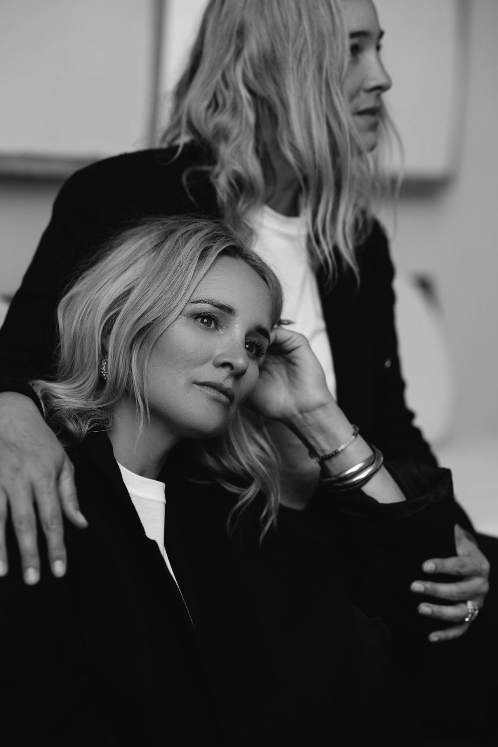 Intimate black and white portrait showing close connection between two women.