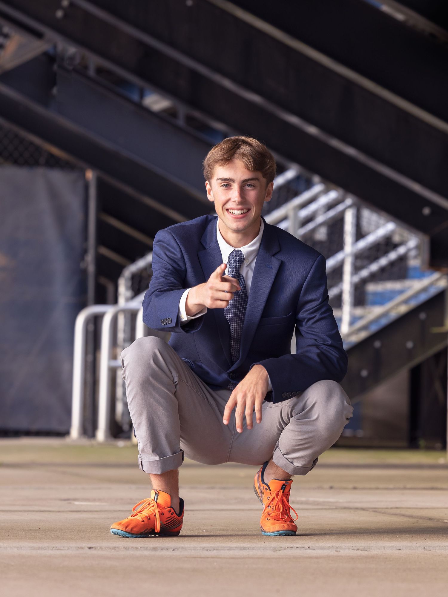 high school senior boy pointing at camera