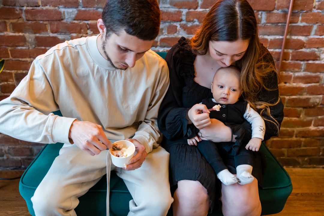 family of 3 enjoying gelato