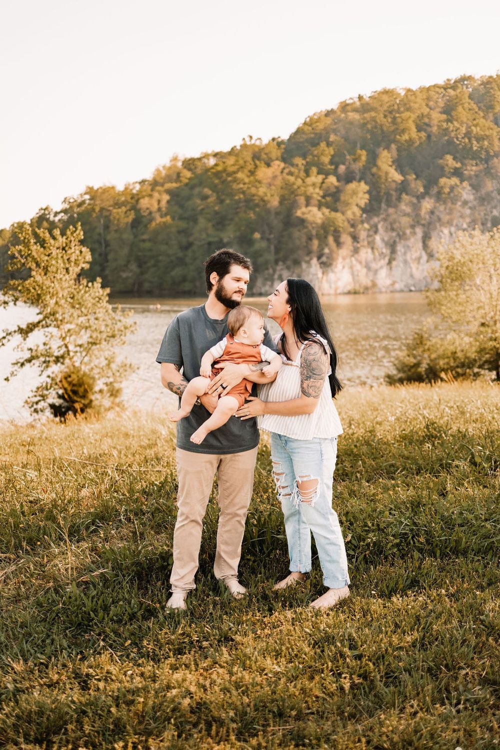 Knoxville family session during golden hour with mom, dad, and baby.