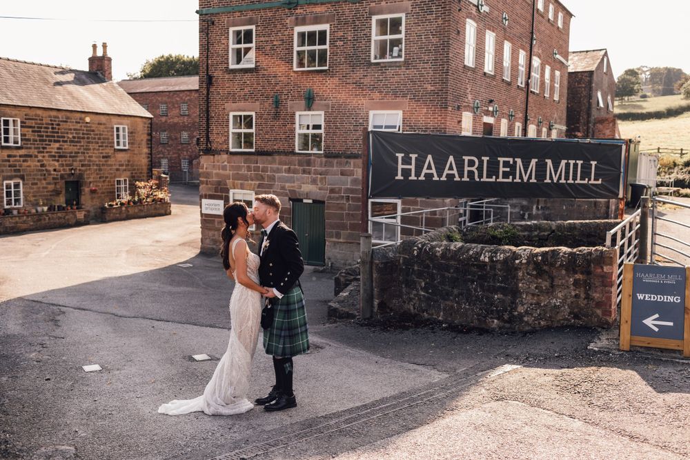 couple standing outside at haarlem mill