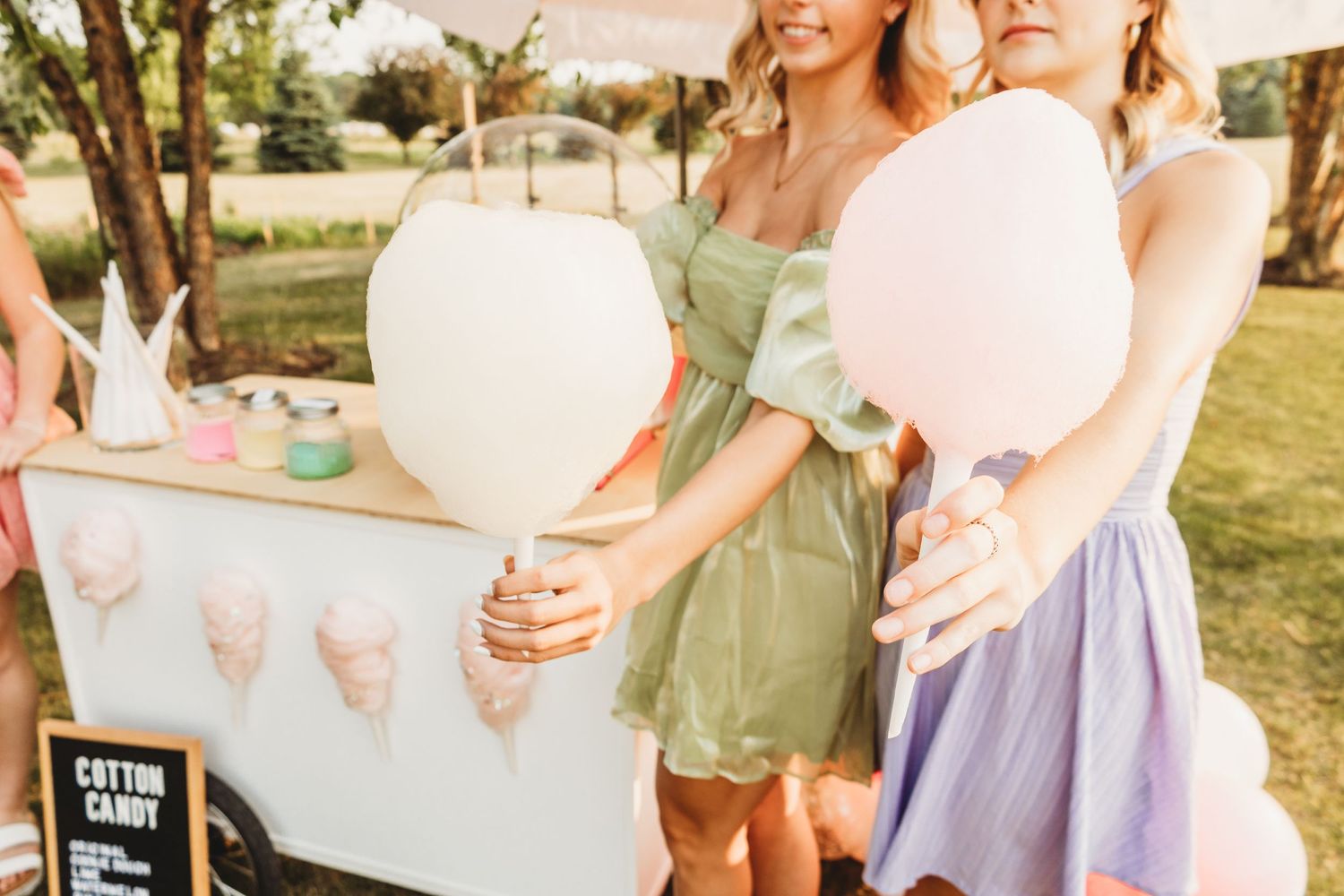 Cotton candy party station with pastel decorations and treats.