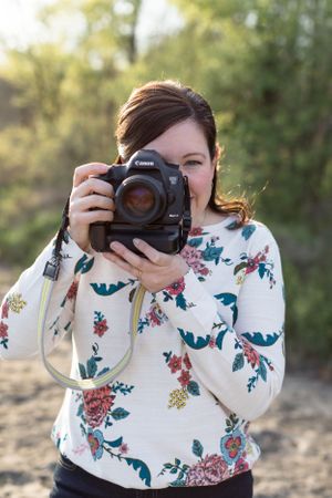 Woman with camera about to take a photo