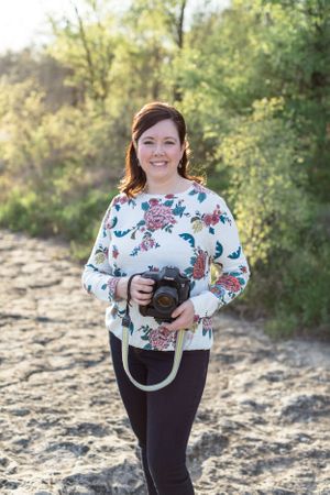 Woman holding her camera by side in Austin, Texas