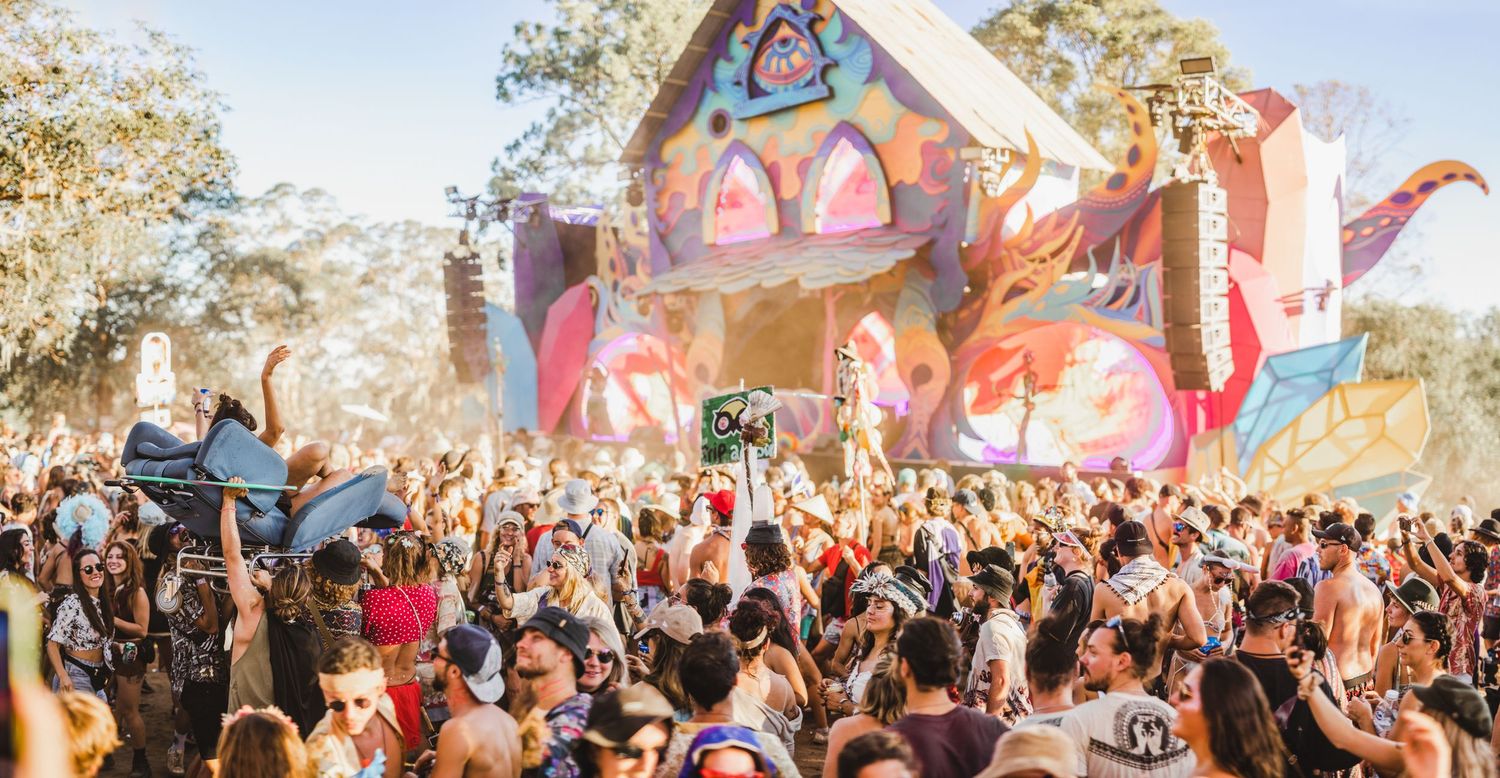 girl crowdsurfing on a chair at Rabbits eat lettuce Music Festival