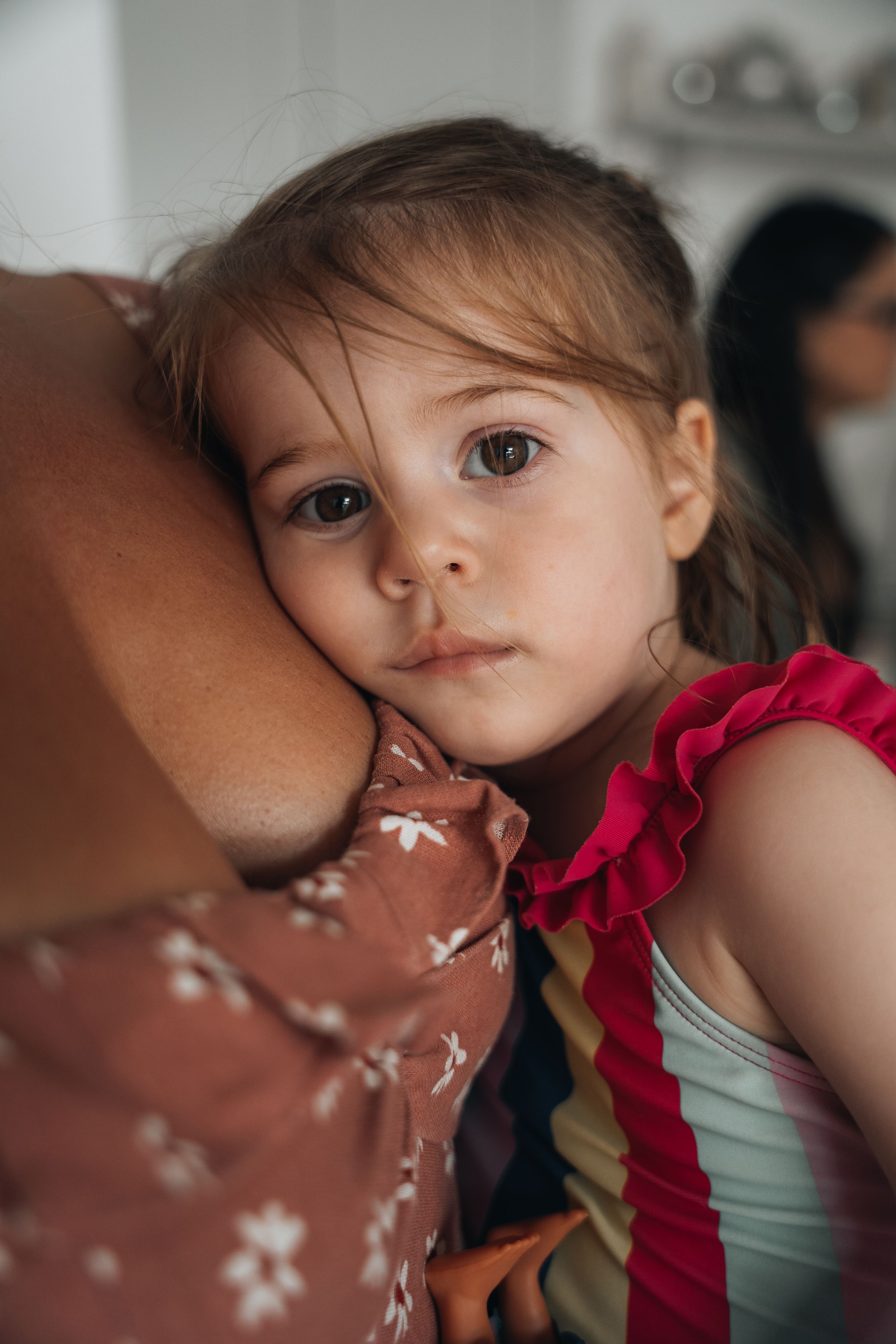 A close-up view of someone wearing a red ruffle dress.