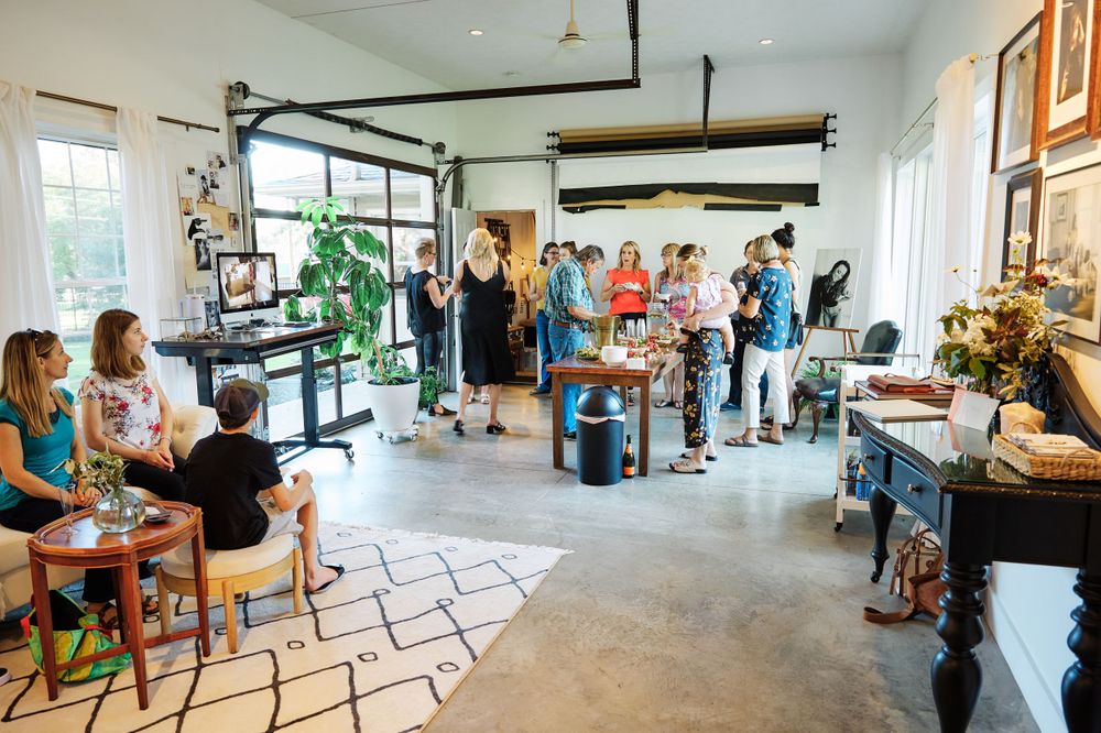 Large open studio space with photography equipment and casual seating areas.