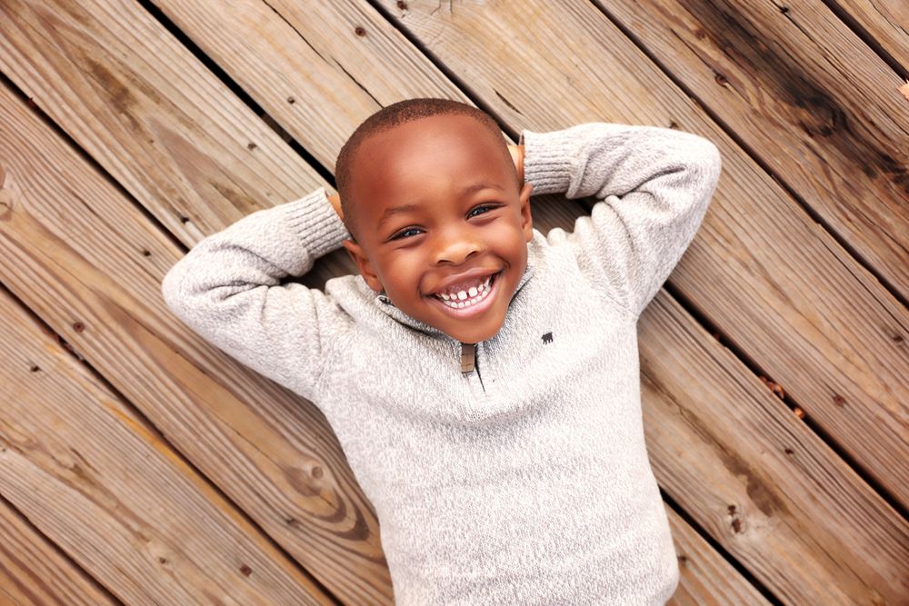 Kids photography, child photographer in Portsmouth New Hampshire. Little boy on wood planks