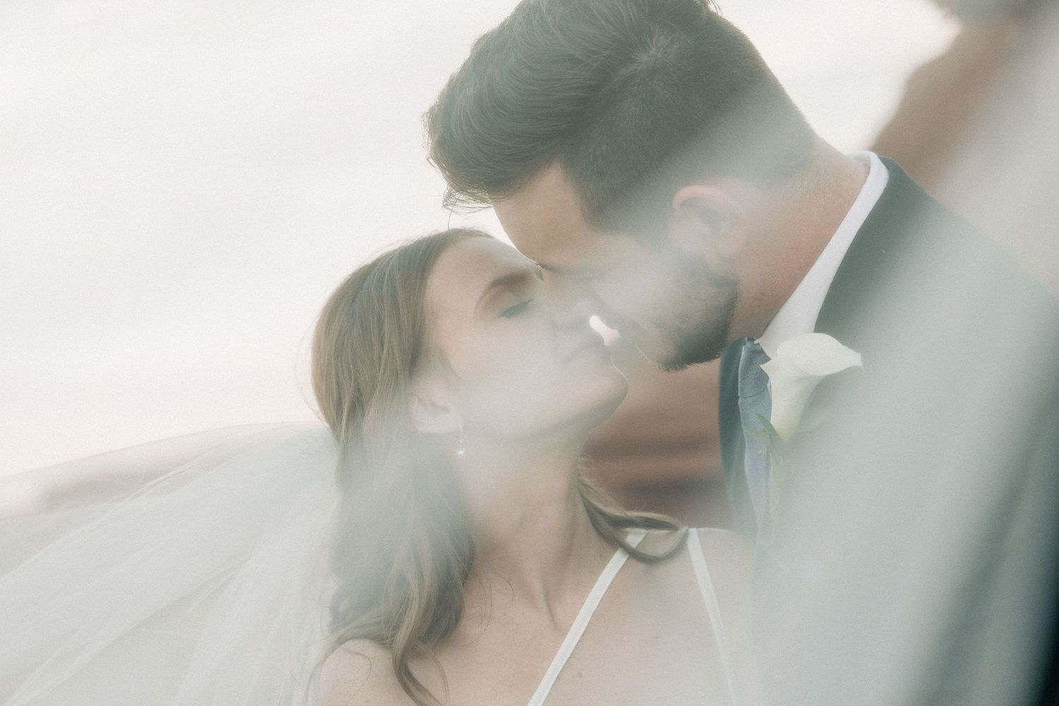 Dreamy soft focus romantic wedding portrait in ethereal light.
