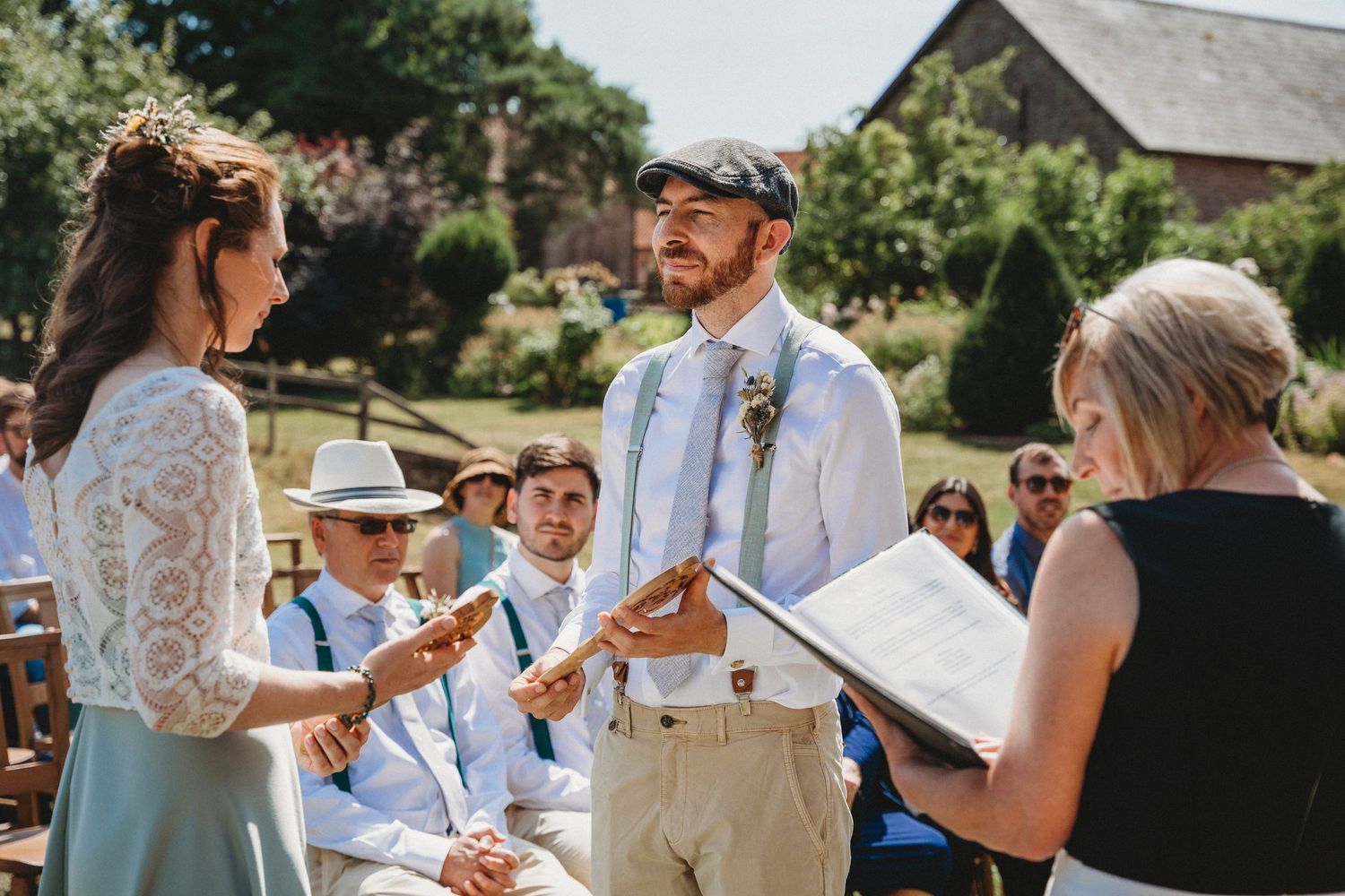 Intimate outdoor wedding ceremony moments captured in garden setting.