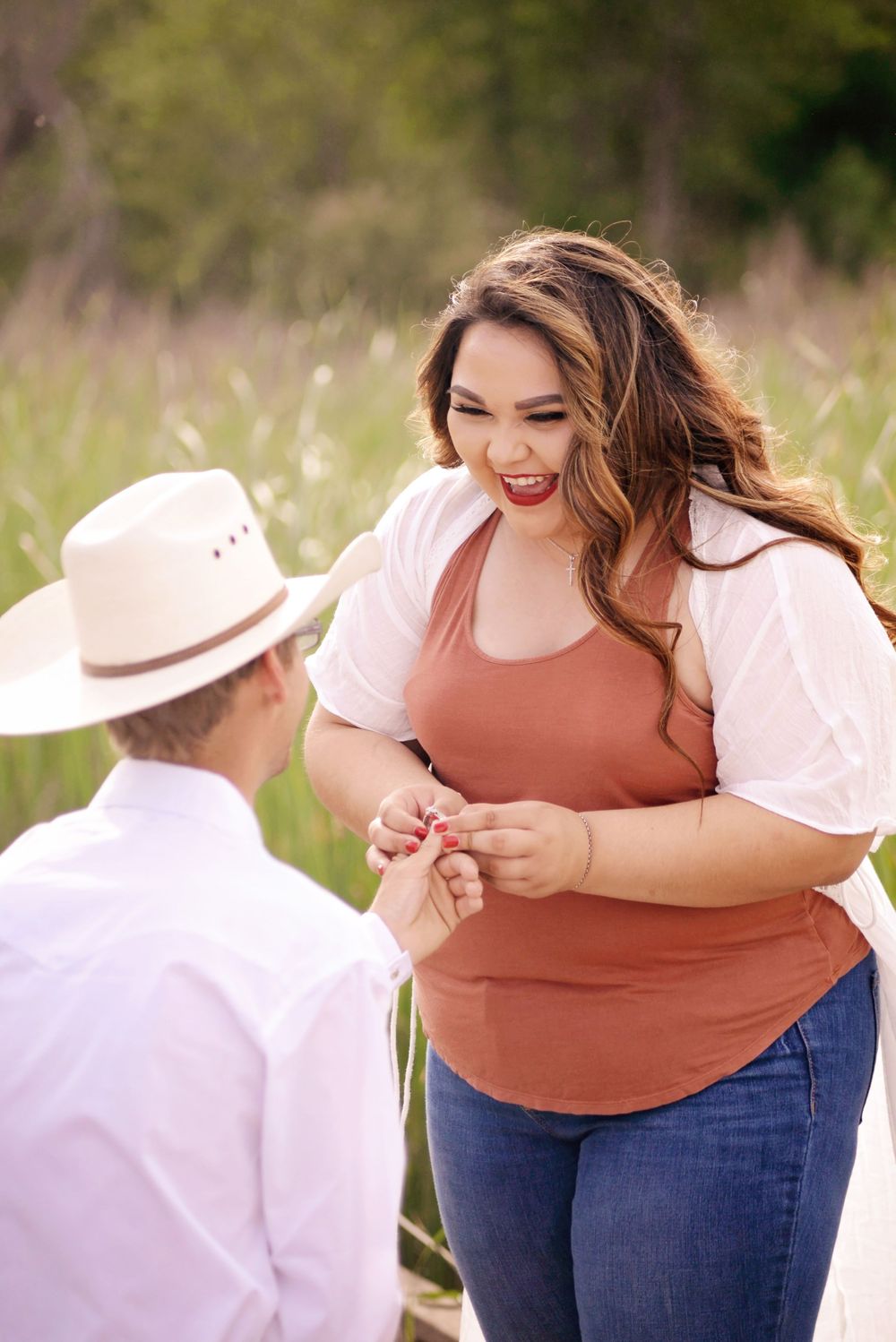 A playful outdoor photoshoot with a couple in casual clothing.