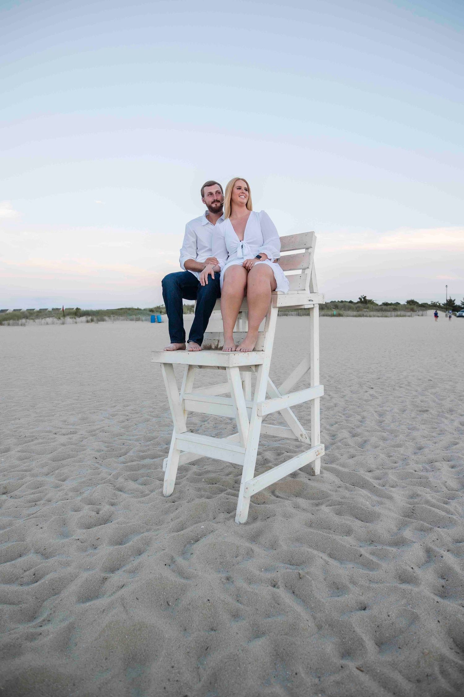 Kayla and Zach at their beach engagement at sunset in Delaware beach Lewes