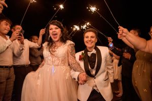 LGBT friendly photographer in buffalo new york captures a beautiful sparkler exit on their wedding day at The Sterling