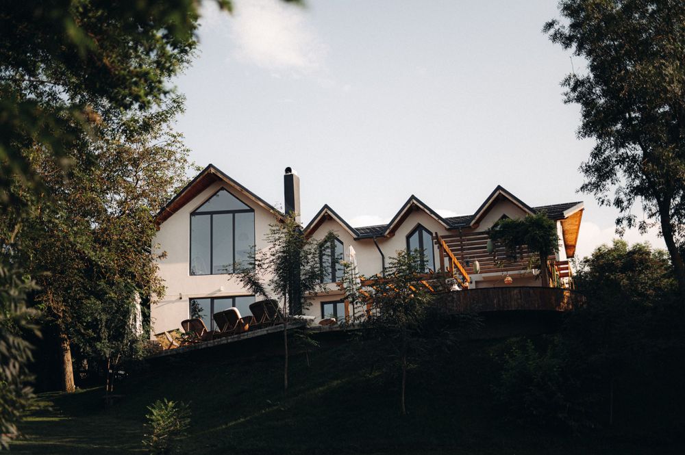 Modern hillside houses with contemporary architecture at dusk.