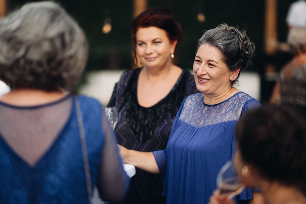 Guests enjoying conversation at an elegant evening celebration.