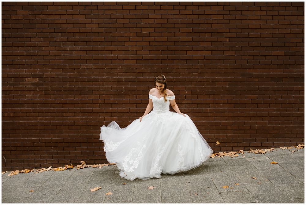 bride playing with her dress