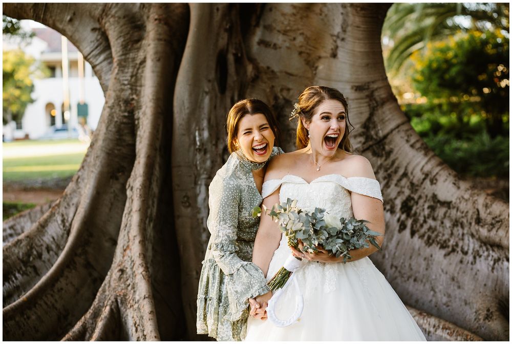 hyde park wedding bride and bridesmaid laughing