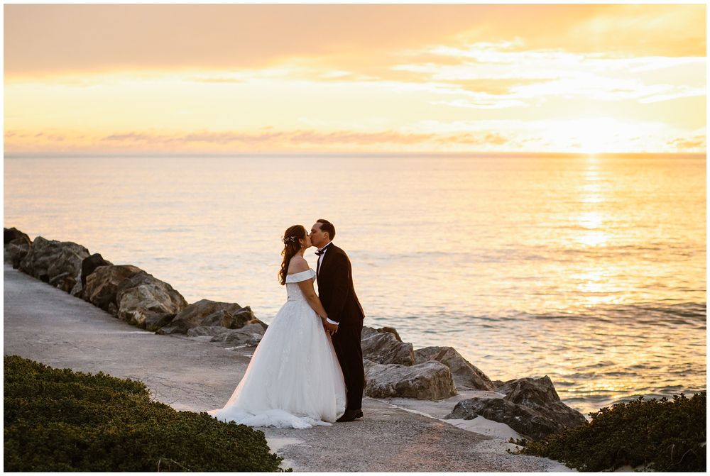 hyde park wedding bride and groom kissing on the jetty at city beach