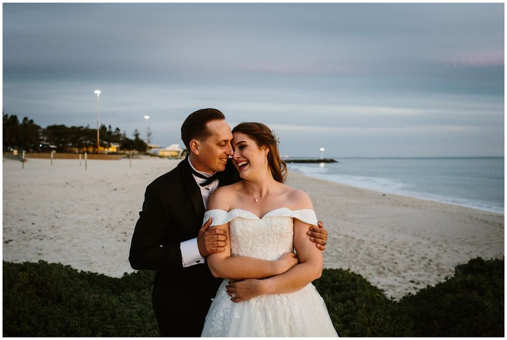 hyde park wedding bride and groom laughing on the beach