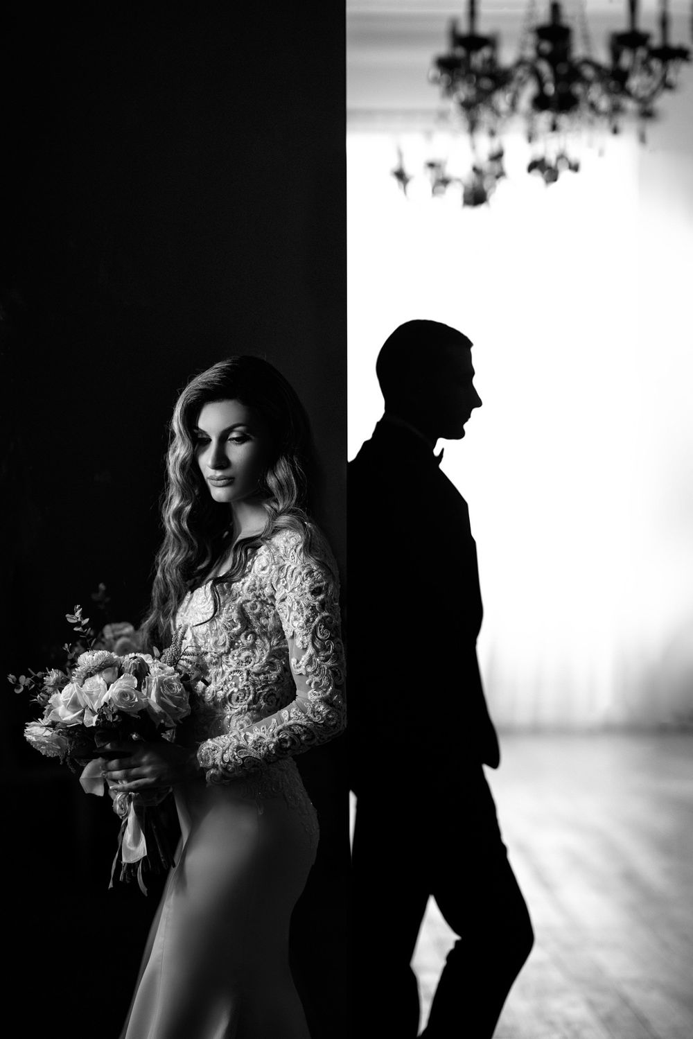 Black and white wedding photography sequence with dramatic lighting and lace details.