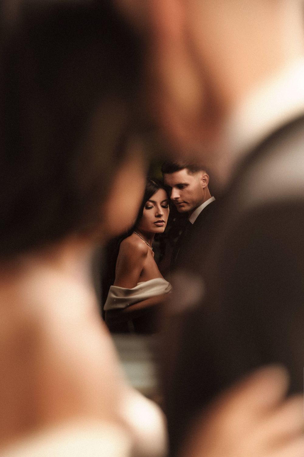 Intimate artistic photography with soft focus and warm tonal gradients.