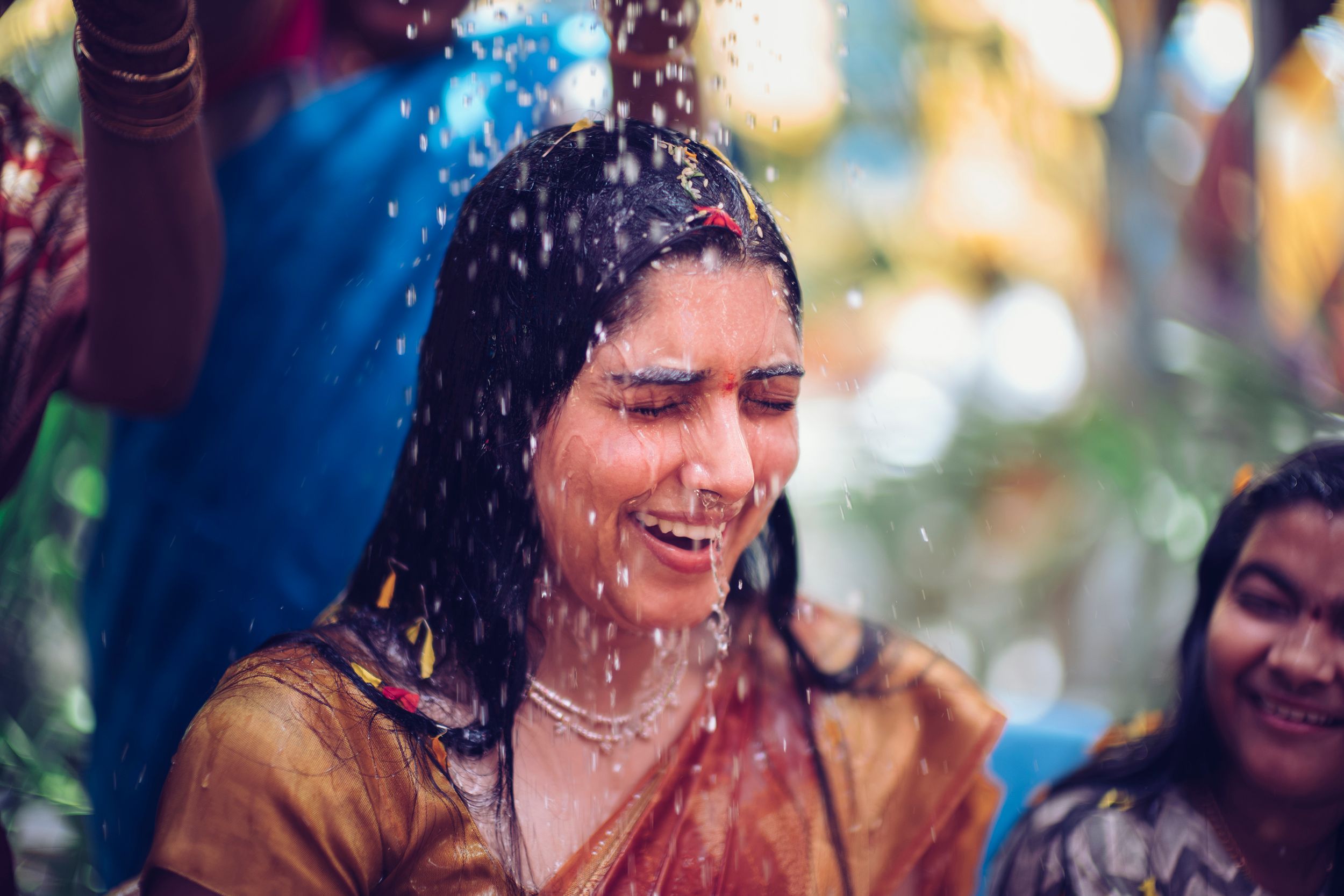 Joyful celebration with water splashes during post haldi.