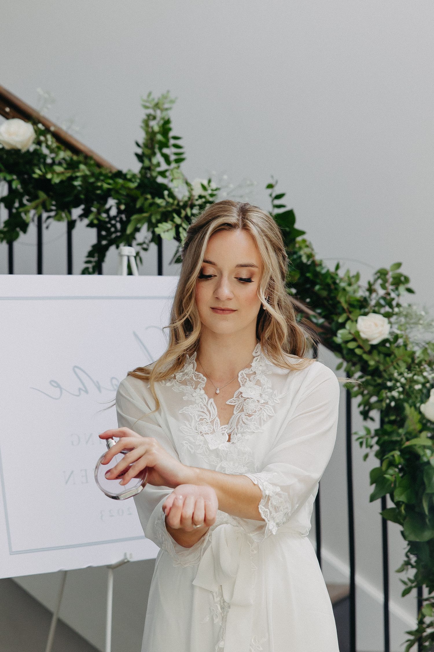 White lace robe captured in elegant bridal getting ready scene.
