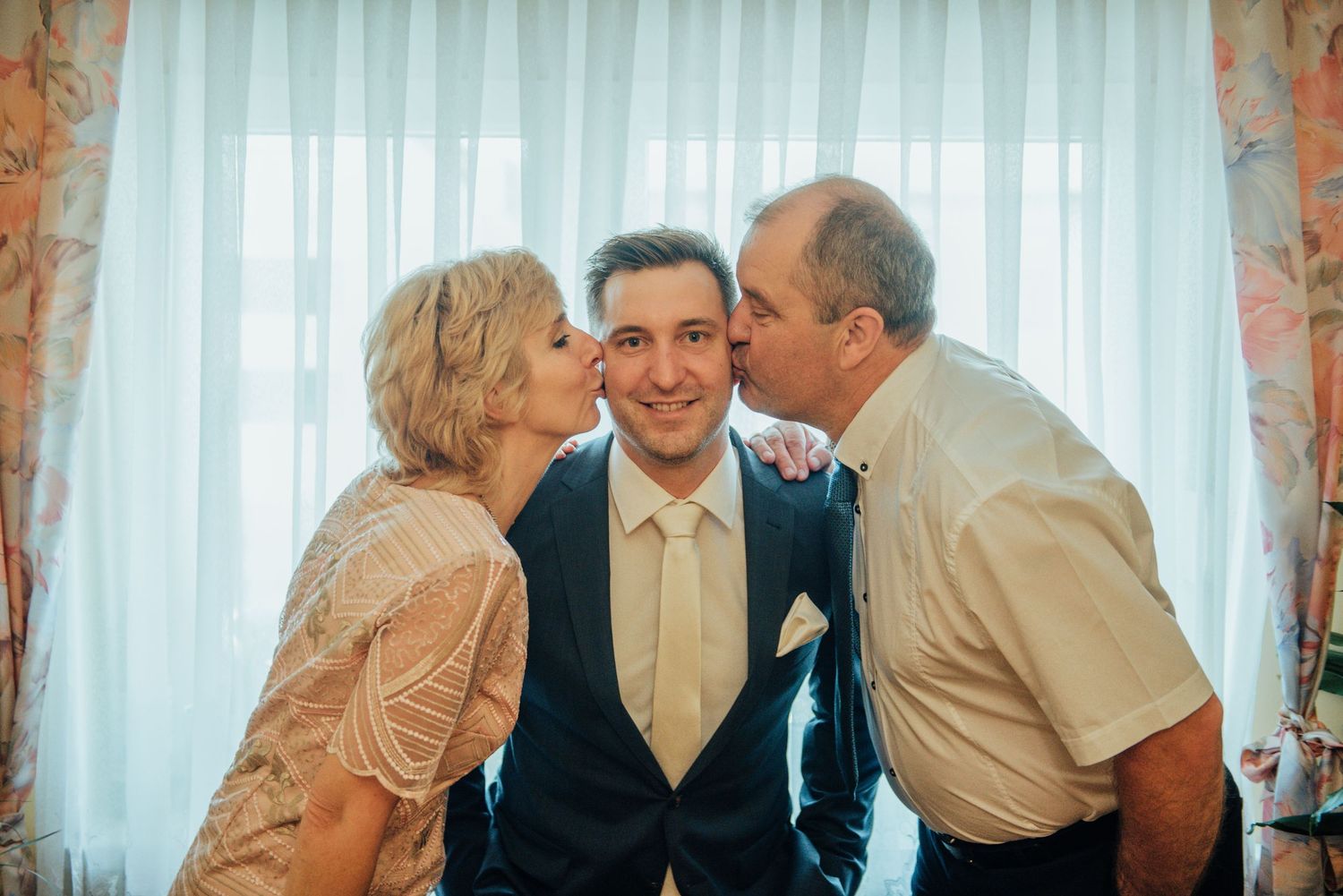 An emotional family moment captured during a wedding celebration.