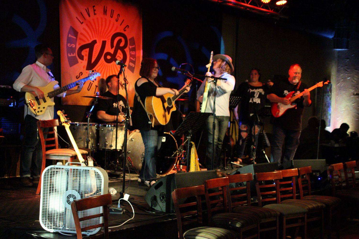 Adaptive Arts Jetta Cruse and her band performing on stage at Vegetable Buddies