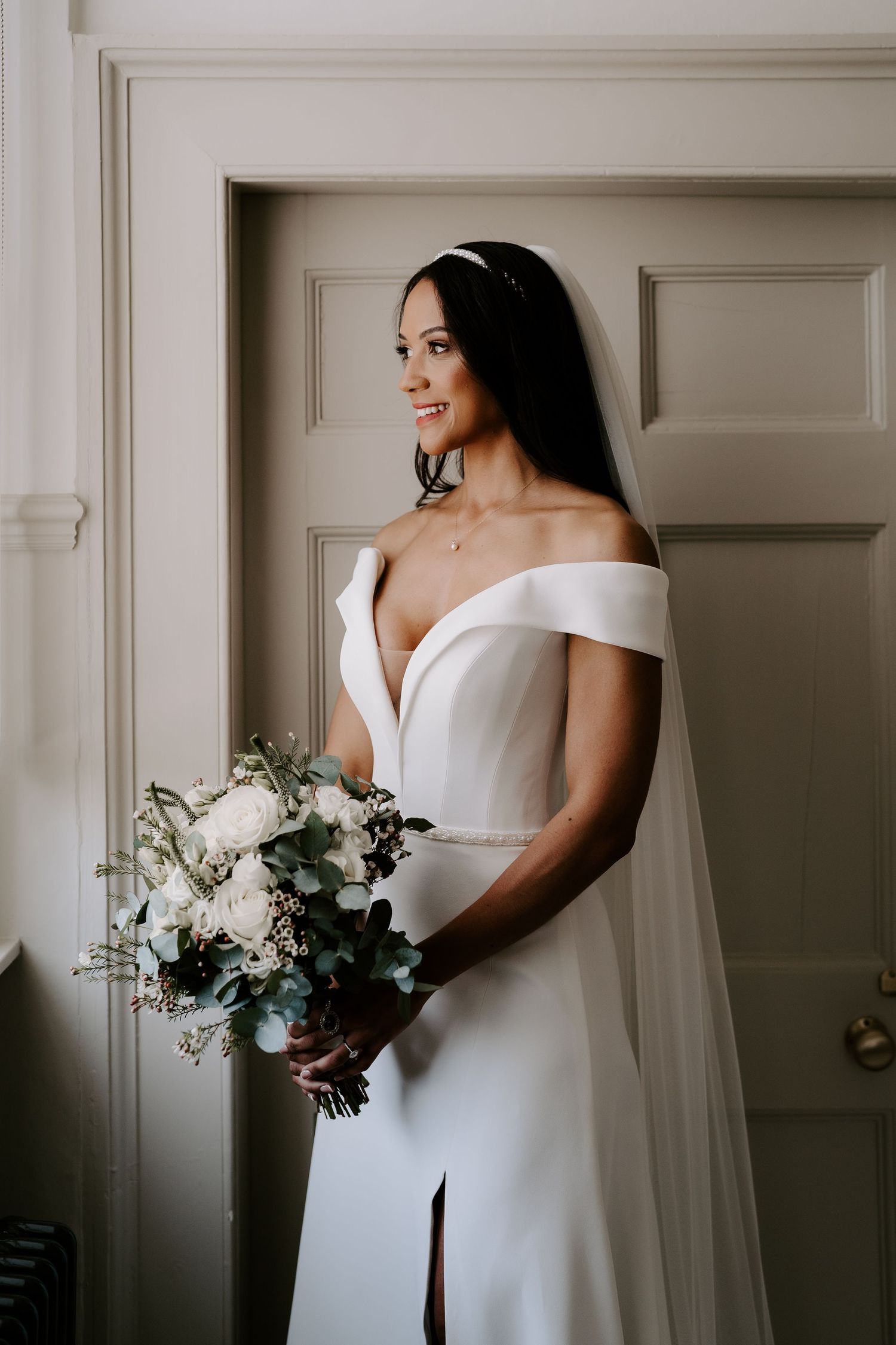bride-stood-by-window-stockton-house-wedding-shropshire