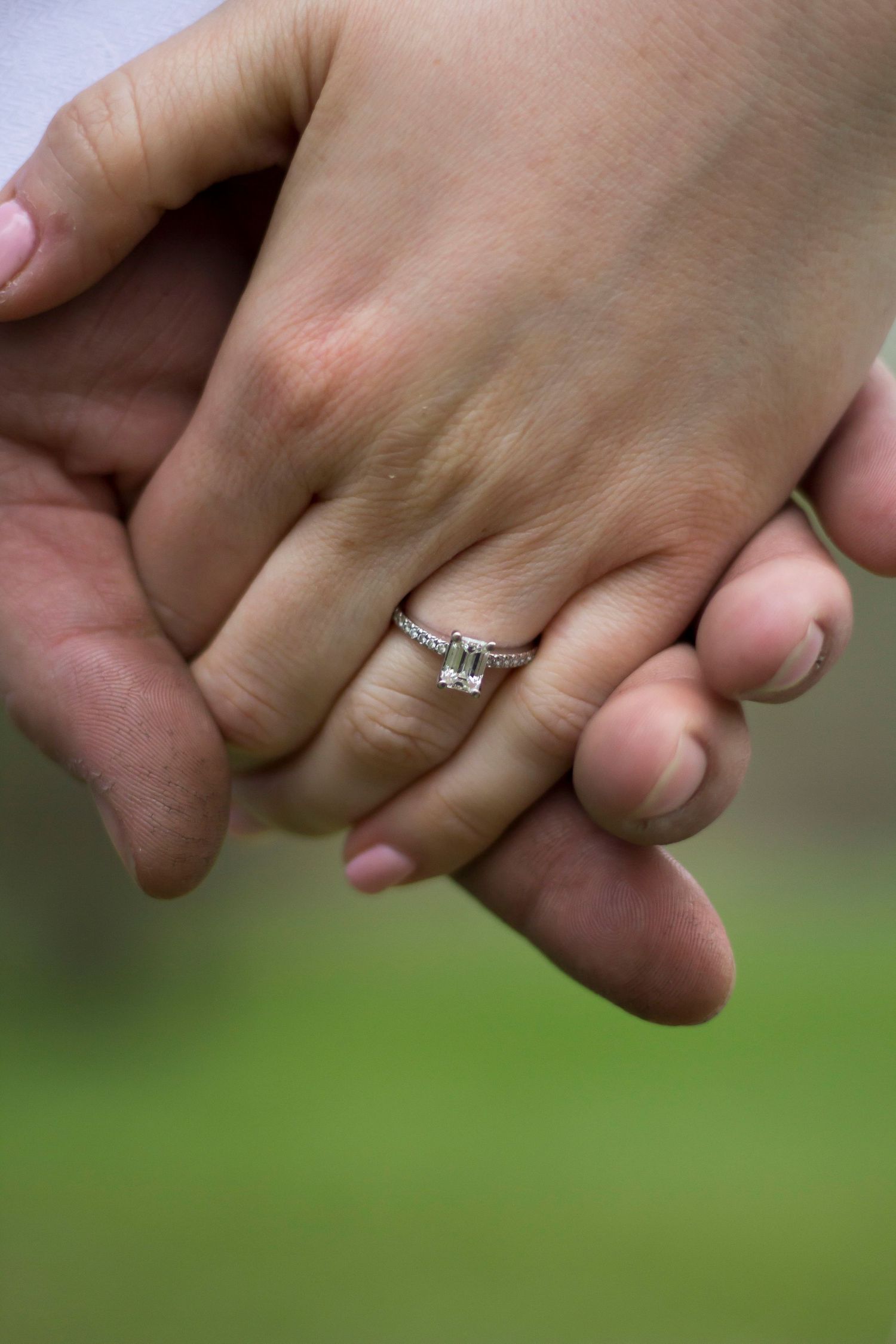 Engagement photoshoot photography holding hands with engagement ring